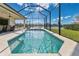 This is a refreshing screened-in pool and patio area with view of a beautiful lake at 3831 Creekside Park Dr, Parrish, FL 34219