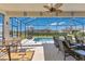 An outdoor screened-in patio provides ample seating and a beautiful view of the pool at 3831 Creekside Park Dr, Parrish, FL 34219