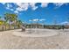 Community splash pad featuring interactive water features and nearby seating in a fenced area at 3831 Creekside Park Dr, Parrish, FL 34219