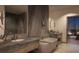 Luxurious bathroom with dual vanity sinks, soaking tub, and modern fixtures at 550 Golden Gate Point # 701, Sarasota, FL 34236