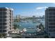 Waterfront condos overlook a beautiful pool, bay and boat marina with city skyline at 550 Golden Gate Point # 701, Sarasota, FL 34236