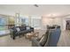 Open-concept living room featuring modern furnishings, tile flooring, and ample natural light at 585 Cutter Ln, Longboat Key, FL 34228