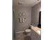 Cozy bathroom with a granite-topped vanity and framed mirrors, creating a clean and inviting space at 5876 Countrywood Dr, Sarasota, FL 34232