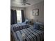 Guest bedroom featuring two twin beds, soft linens, and a cozy atmosphere for restful nights at 5876 Countrywood Dr, Sarasota, FL 34232