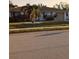 Charming one-story home featuring a well-maintained lawn and attached garage at 5876 Countrywood Dr, Sarasota, FL 34232