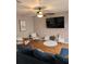Inviting living area with a large TV, modern furniture, and stylish decor for comfortable living at 5876 Countrywood Dr, Sarasota, FL 34232