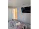 Neutral decor compliments the natural light in the main bedroom with ensuite bath at 5876 Countrywood Dr, Sarasota, FL 34232