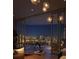 Balcony with city view, dining table, and light fixture at 590 Golden Gate Point # 506, Sarasota, FL 34236