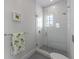 Clean, modern bathroom with glass-enclosed shower and stylish fixtures at 624 N Point Dr, Holmes Beach, FL 34217