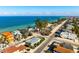 An aerial view of the coastal neighborhood, showcasing beach access and ocean views from most homes at 912 N Shore Dr, Anna Maria, FL 34216