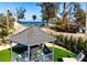 Beautiful gazebo featuring outdoor seating with ocean view in the background at 912 N Shore Dr, Anna Maria, FL 34216