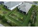 Aerial view of a private backyard with well-maintained lawn and dark metal fencing at 9978 Bright Water Drive, Englewood, FL 34223