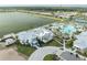 Aerial view of community center with lake views, swimming pool and clubhouse at 9978 Bright Water Drive, Englewood, FL 34223