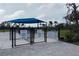 Community dog park featuring separate areas for large and small dogs with shady pavilion at 9978 Bright Water Drive, Englewood, FL 34223