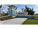 Community entrance sign at Beachwalk by Manasota Key with blue-tone tower and small fountain feature at 9978 Bright Water Drive, Englewood, FL 34223