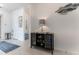 Home entryway featuring stylish decor, including a console table and decorative fish wall hanging at 9978 Bright Water Drive, Englewood, FL 34223