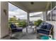 Inviting screened lanai with comfortable seating, perfect for enjoying outdoor relaxation and serene views at 9978 Bright Water Drive, Englewood, FL 34223