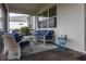 Relaxing screened lanai with plush seating, ideal for enjoying the outdoors in comfort and style at 9978 Bright Water Drive, Englewood, FL 34223