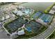 Aerial shot of community tennis courts, bocce ball and recreation area at 9978 Bright Water Drive, Englewood, FL 34223