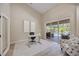 Office features a modern desk, decor, chair, and sliding glass doors overlooking a pool at 1314 Brambling Ct, Bradenton, FL 34212