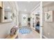 Elegant foyer features tile flooring, a decorative mirror, and French doors leading to the office at 16741 Ellsworth Ave, Bradenton, FL 34202