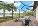 Enclosed patio with outdoor seating and picturesque view of a lake at 16741 Ellsworth Ave, Bradenton, FL 34202