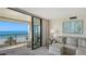 Relaxing oceanfront balcony with seating, offering panoramic views of the beach and Gulf at 2675 Gulf Of Mexico Dr # 301, Longboat Key, FL 34228