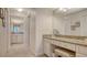 Bathroom vanity and makeup area with granite countertops, vanity lighting, and neutral walls at 2675 Gulf Of Mexico Dr # 301, Longboat Key, FL 34228