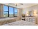 Well-lit bedroom includes two twin beds, dresser with sunset view and big, bright windows at 2675 Gulf Of Mexico Dr # 301, Longboat Key, FL 34228