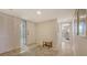 Welcoming entryway boasts tile floors, decorative glass door, coat closet, and neutral color palette at 2675 Gulf Of Mexico Dr # 301, Longboat Key, FL 34228