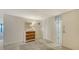 Inviting entryway features decorative glass door, coat closet, and dresser with decorative mirror at 2675 Gulf Of Mexico Dr # 301, Longboat Key, FL 34228