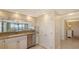 Bright kitchen view with stainless appliances, stylish backsplash, and views to the living area at 2675 Gulf Of Mexico Dr # 301, Longboat Key, FL 34228