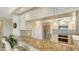 Well-equipped kitchen featuring granite counters and stainless steel appliances at 2675 Gulf Of Mexico Dr # 301, Longboat Key, FL 34228