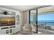 Cozy living space opens to a balcony with ocean view, perfect for relaxing or entertaining at 2675 Gulf Of Mexico Dr # 301, Longboat Key, FL 34228