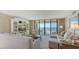 Spacious living room with plush seating and stunning ocean views at 2675 Gulf Of Mexico Dr # 301, Longboat Key, FL 34228