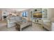 Inviting living room with a comfortable sofa, entertainment center, and open floor plan at 2675 Gulf Of Mexico Dr # 301, Longboat Key, FL 34228