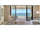 Living room view to the balcony and ocean at 2675 Gulf Of Mexico Dr # 301, Longboat Key, FL 34228
