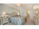 Comfortable main bedroom featuring ensuite bath, carpet floors, and ample natural light at 2675 Gulf Of Mexico Dr # 301, Longboat Key, FL 34228
