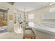 Bright kitchen bar area featuring a breakfast nook with outdoor views, perfect for casual dining at 28 Tall Trees Ct, Sarasota, FL 34232