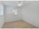 Bedroom featuring light floors, ceiling fan, and neutral walls at 2930 Prospect St, Sarasota, FL 34239