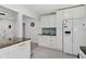 Bright kitchen with white cabinets, modern appliances, and stylish countertops connects to the living room at 2930 Prospect St, Sarasota, FL 34239