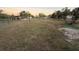 Large, unfenced backyard offers potential for outdoor activities and landscaping at 3054 Mancini Ter, Punta Gorda, FL 33983