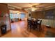 Dining room features decorative wallpaper and an open view of the enclosed sunroom at 3054 Mancini Ter, Punta Gorda, FL 33983