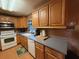 Functional kitchen featuring classic wood cabinets, and neutral countertops at 3054 Mancini Ter, Punta Gorda, FL 33983