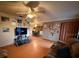 Comfortable living room with entertainment center and seamless access to the dining area at 3054 Mancini Ter, Punta Gorda, FL 33983