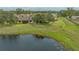 Aerial shot of home featuring lake, large yard, and mature tree coverage at 3119 Glen Elyn Blvd # 9, Sarasota, FL 34237