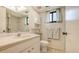 Well-lit bathroom with updated vanity, tile flooring, and shower with decorative curtain at 3119 Glen Elyn Blvd # 9, Sarasota, FL 34237