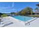 Community pool with clear blue water and ample space for lounging at 3119 Glen Elyn Blvd # 9, Sarasota, FL 34237