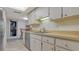 Kitchen features stainless steel dishwasher, double sink, and bright natural lighting at 3119 Glen Elyn Blvd # 9, Sarasota, FL 34237