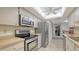 Bright kitchen featuring stainless steel appliances, white cabinetry and recessed lighting at 3119 Glen Elyn Blvd # 9, Sarasota, FL 34237